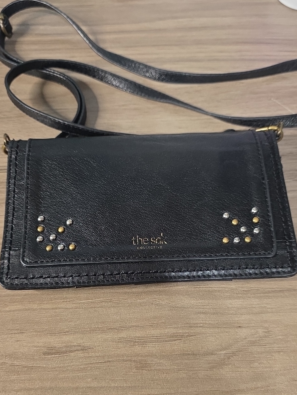 The Sak Black Leather Crossbody Wallet with Mixed Metal Studs